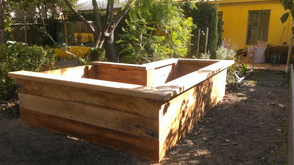 L-shape veggie bed with seating designed & built by Yummy Gardens Melbourne