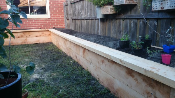 Lshaped raised veggie bed along fence by Yummy Gardens Melbourne