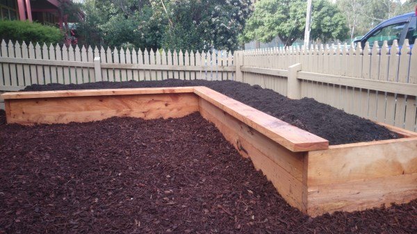 Lshaped veggie bed in front yard by Yummy Gardens Melbourne