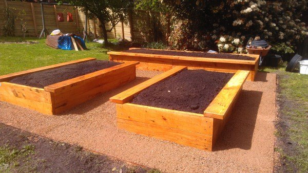 Raised cypress veggie beds bordered by crushed stone designed & built by Yummy Gardens Melbourne