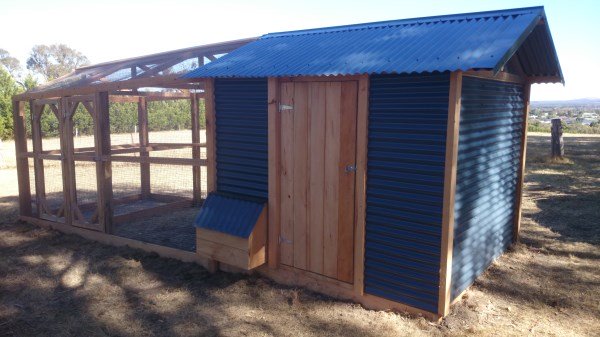 Back view of chook house with pitched roof & run by Yummy Gardens Melbourne