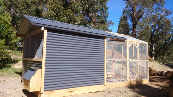 Colour bond chook house with rear enclosed pitched roof run by Yummy Gardens Melbourne