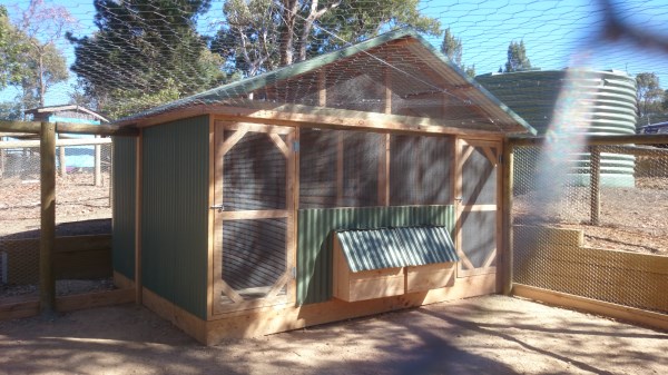 Double sided pitched roof chicken house in enclosed run by Yummy Gardens Melbourne